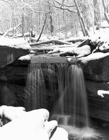 Black and white snow scene of Waterfall in Central Park, New York City
