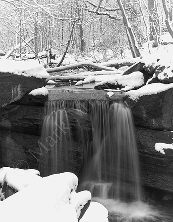 Black and white snow scene of Waterfall in Central Park, New York City